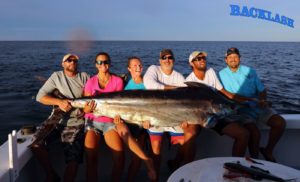 group of fishers with a blue marlin